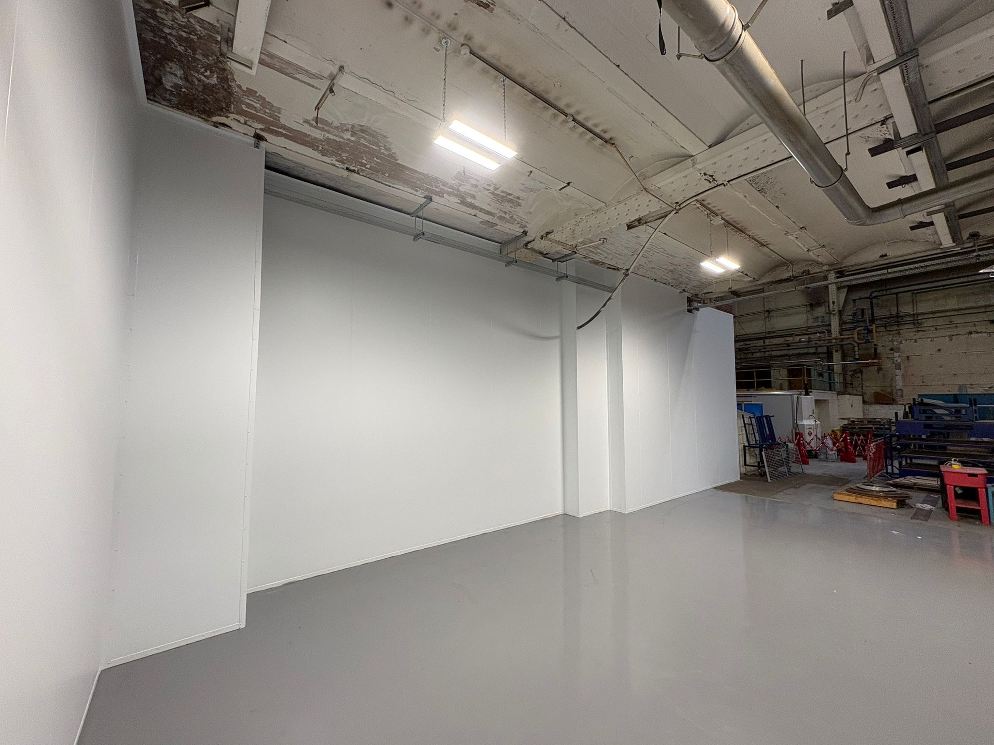 Hygienic panel wall construction within food processing facility